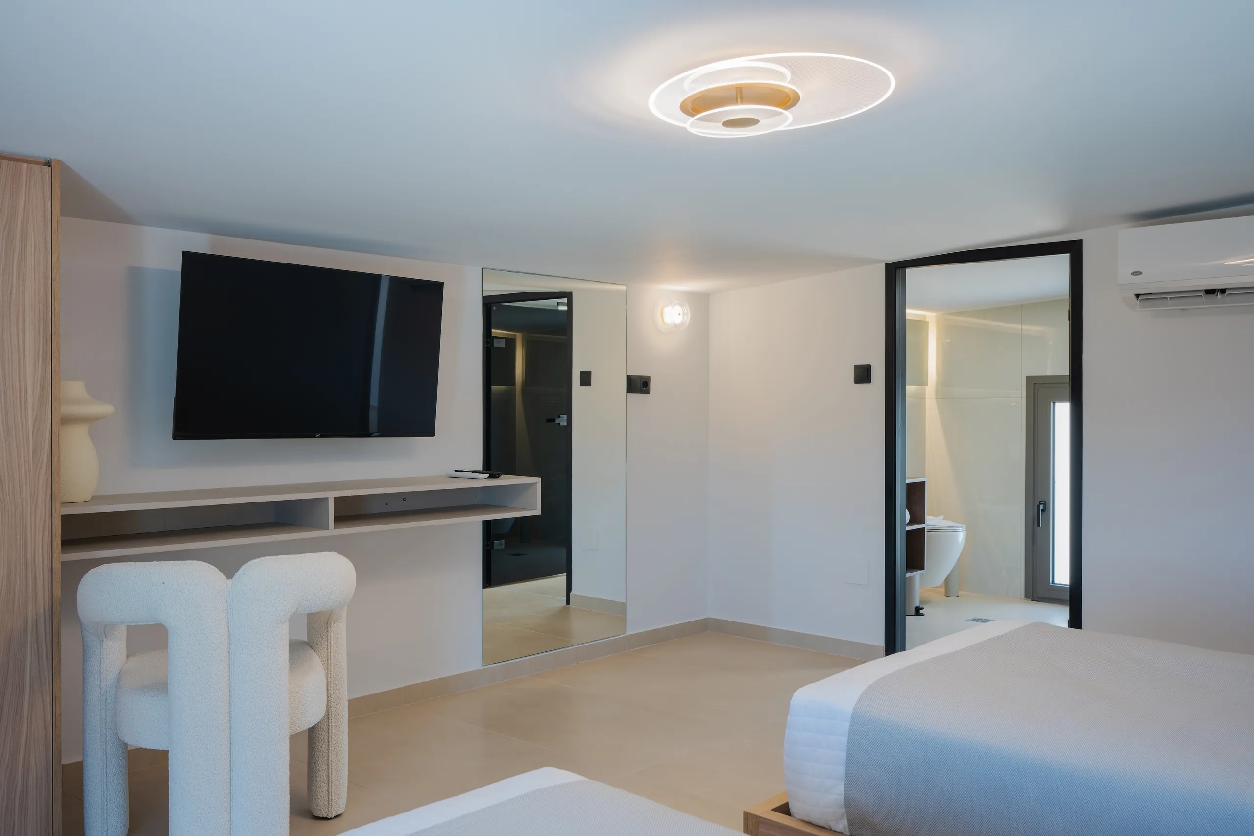 Left Crete bedroom four with garden light and warm timber details