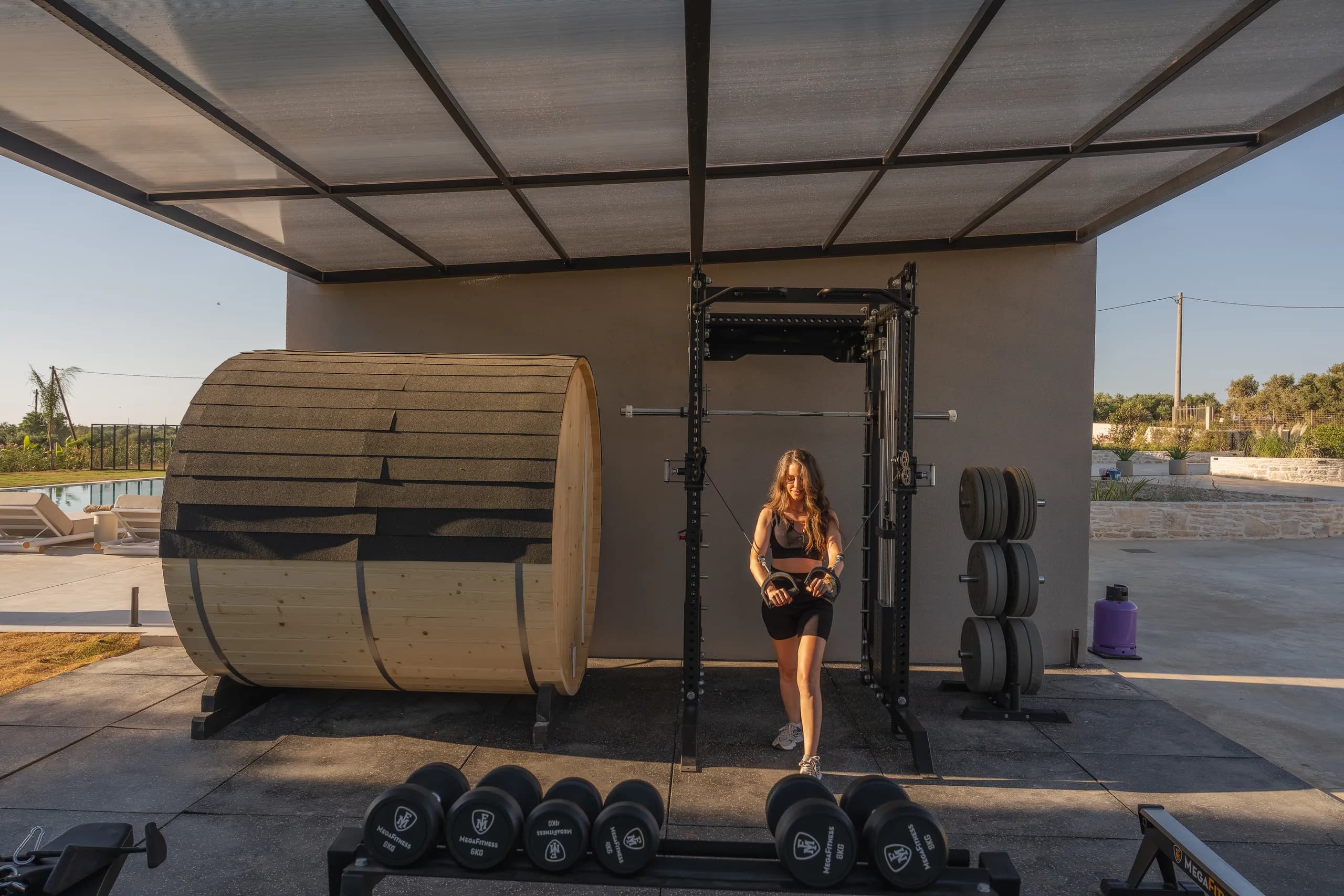 Left Crete's shaded outdoor gym with weights and a timber sauna